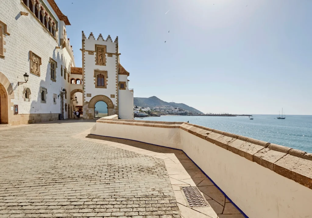 The Passeig de Ribera with the Palau Maricel façade and Mediterranean Sea views