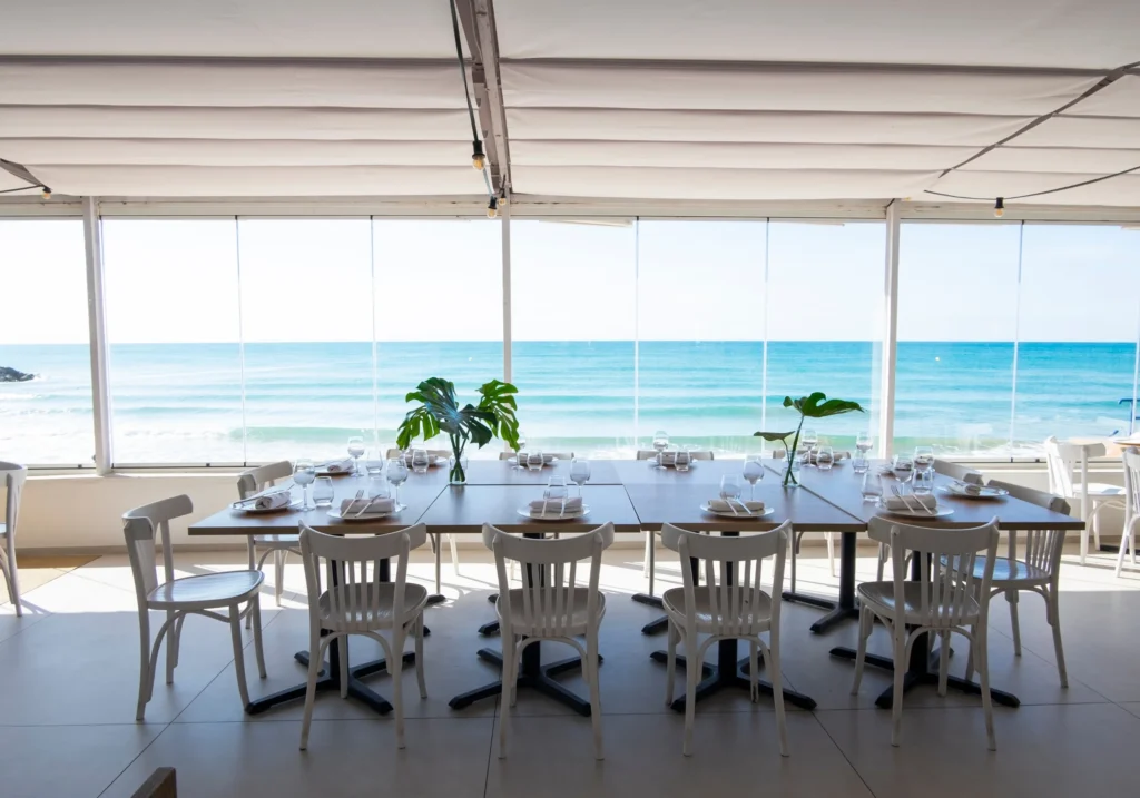Table set in a beachfront restaurant with panoramic sea views in Sitges